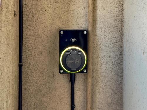 a black electrical outlet on the side of a wall at Grange Garth near the river in York