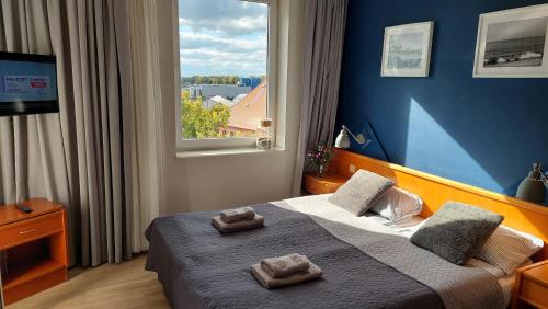 Posteľ alebo postele v izbe v ubytovaní Apartament Sympatia Kołobrzeg Etna Polonia 718