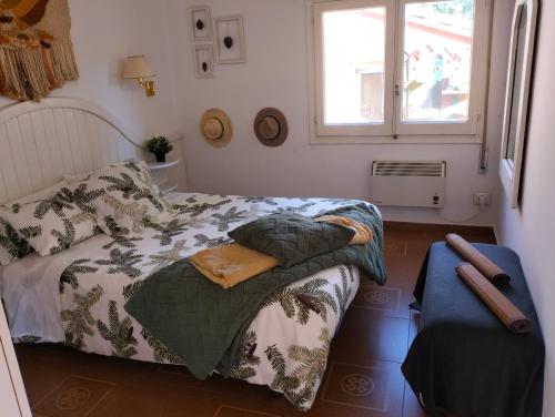 a small bedroom with a bed and a window at Encanto en el Moncayo in San Martín de Moncayo