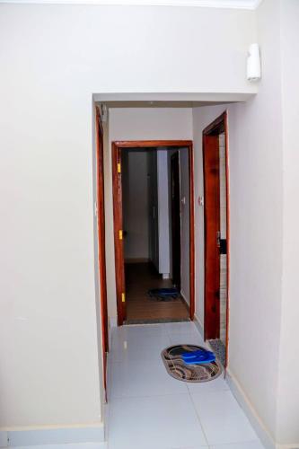 a room with a door and a mirror in a room at Sunrise Nyali Mombasa 1bdrm Scenic Sea View in Mombasa