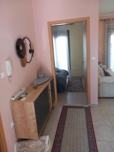 a living room with a door open to a room at Αλέξανδρος Δισπηλιό in Dispilio