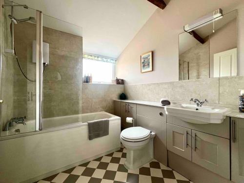 a bathroom with a toilet and a sink and a shower at The View Cottage - Tennis Court - Nr Frome, Longleat in Frome