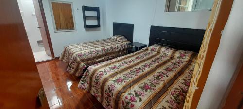 Ένα ή περισσότερα κρεβάτια σε δωμάτιο στο Hotel Reyna
