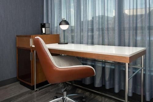 an office with a desk and a chair and a window at Courtyard by Marriott Washington, DC Dupont Circle in Washington