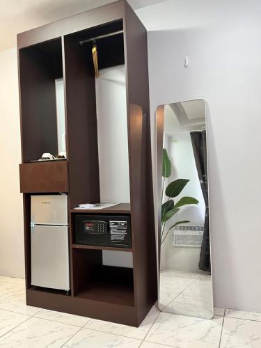 a mirror in the corner of a room with a computer at I - scape in Subic