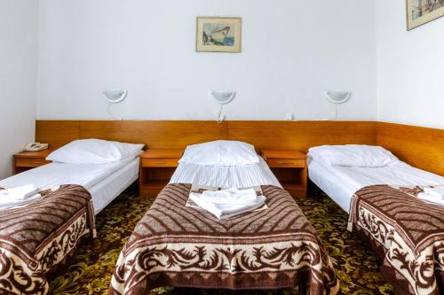 Postel nebo postele na pokoji v ubytování Hotel Dom Marynarza