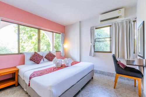 Postel nebo postele na pokoji v ubytování Hua Hin Star Hotel