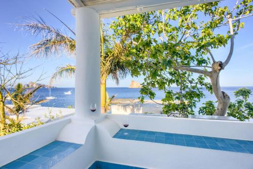 a bath tub with a view of the ocean at Eunymos Panarea in Panarea