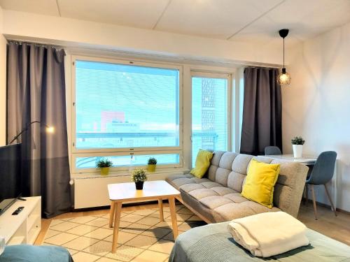 Foto Kotimaailma Apartments - Kaunis 10 kerroksen parvekkeellinen yksiö - Peltokatu 2