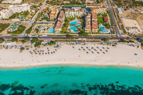 an aerial view of a resort with a beach at Beachfront- Eagle Beach- Top View 1BR condo - P514 in Palm-Eagle Beach