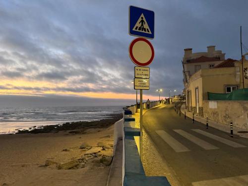 a street with street signs on the beach at Atlantic Views Sintra Guest House in Colares