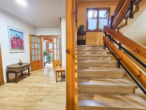 a staircase in a house with wooden floors at Hotel Casa Morlans 3000 in Panticosa