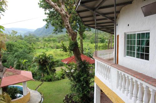 a balcony of a house with a view of the mountains at Hotel Valle Verde in Valle de Anton