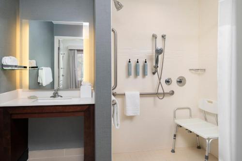 a bathroom with a sink and a shower at Residence Inn by Marriott Kingston in Kingston
