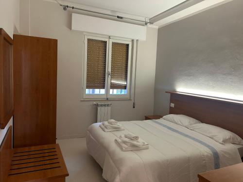 Postel nebo postele na pokoji v ubytování Hotel Ristorante StellAmiata