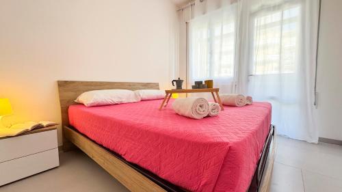 Postel nebo postele na pokoji v ubytování Appartamento Madagascar by Ca-Sa Check