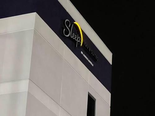 a scientology sign on the side of a building at Sleep Inn & Suites Memphis Southeast in Memphis