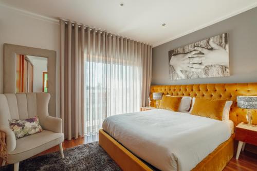 En eller flere senge i et værelse på Pool & Cinema Villa by Vacationy