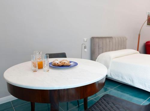 Postel nebo postele na pokoji v ubytování Palazzo De Gregorio Deluxe Room