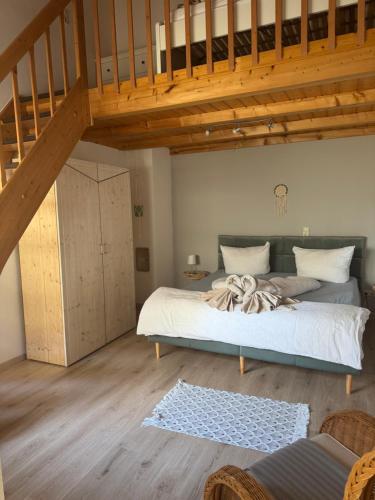 Postel nebo postele na pokoji v ubytování Eleven Apartments