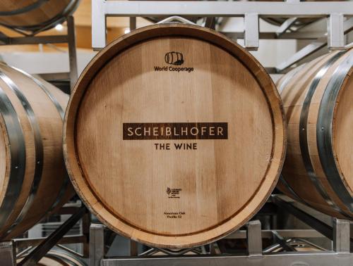 a bunch of wine barrels in a cellar at The Hang Over in Andau