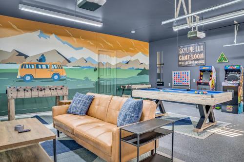 a living room with a couch and a ping pong table at Amazing House - Movie & Game Room, Hot Tub, Fire Pit & Golf Course in Luray