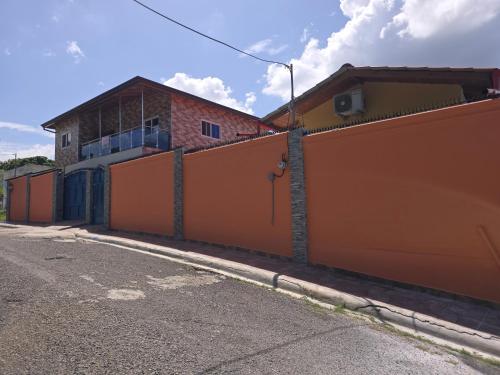 an orange fence in front of a building at Villa Bellevue appartment in San Felipe de Puerto Plata