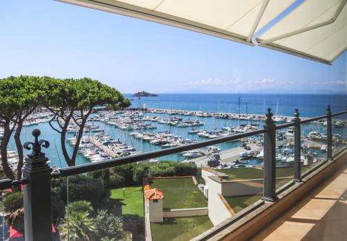 a view of a marina from a balcony at Cala del Porto Punta Ala - Preferred Hotels in Punta Ala