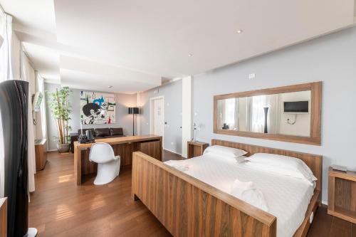 Posteľ alebo postele v izbe v ubytovaní MO.OM Hotel