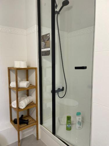 a bathroom with a shower with a glass door at Hostal El Ninot in Barcelona