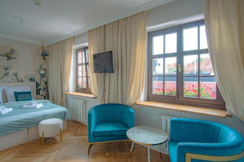 Ένα ή περισσότερα κρεβάτια σε δωμάτιο στο Motlawa Apartments Gdansk Old Town