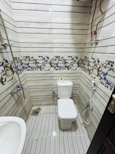 a bathroom with a toilet and a sink at ANA-KA Guest house in Aswan