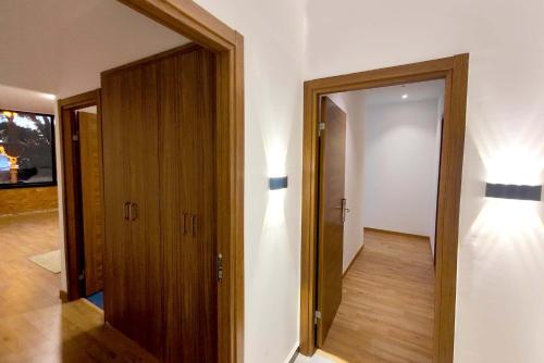 a room with a door and a hallway with lights at Villa Mirasol Hotel in Tangier