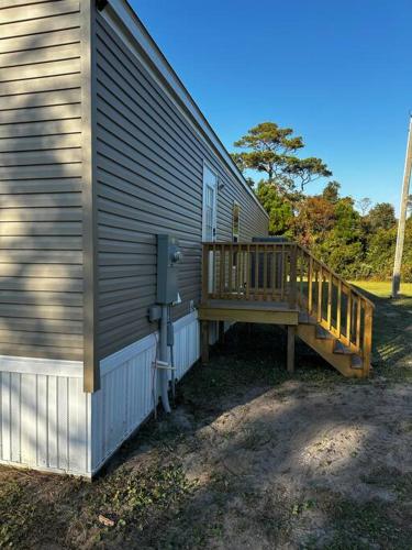 a porch on the side of a house at Ferry Retreat in Cedar Island
