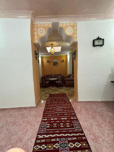 a hallway with carpets on the floor in a room at House andalous in Fez