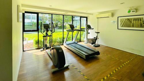 a gym with two treadmills and a treadmill at 47near Shopping Malls and Naka night market in Phuket Town