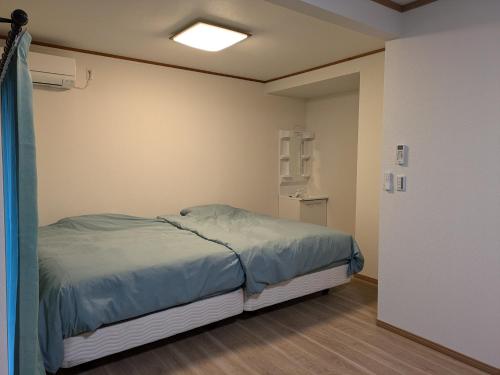 Postel nebo postele na pokoji v ubytování お宿みとしる