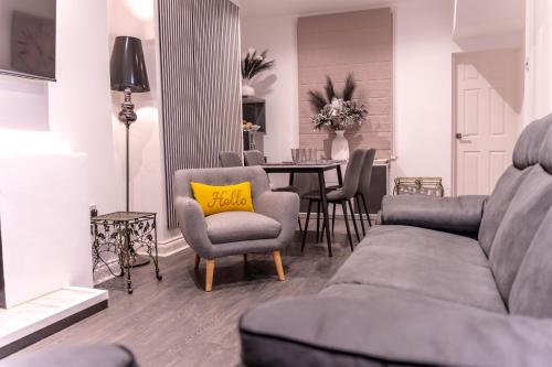 a living room with a couch and a table at Lodging in Carrickfergus Centre in Carrickfergus