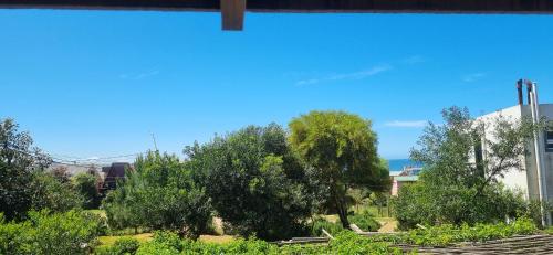 a view from a window of a park with trees at CHochitas 4p in Punta Del Diablo