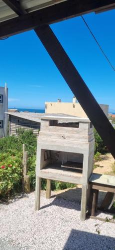 a wooden oven sitting on top of a table at CHochitas 4p in Punta Del Diablo