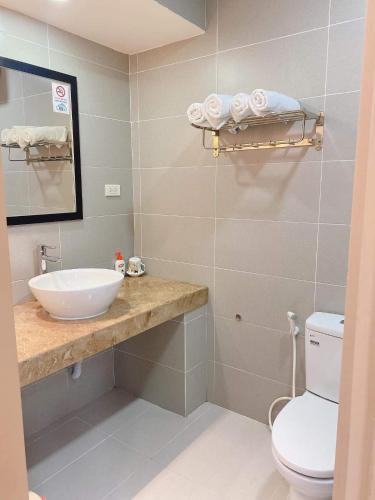 a bathroom with a sink and a toilet at Luna Rossa Villa in Hoi An