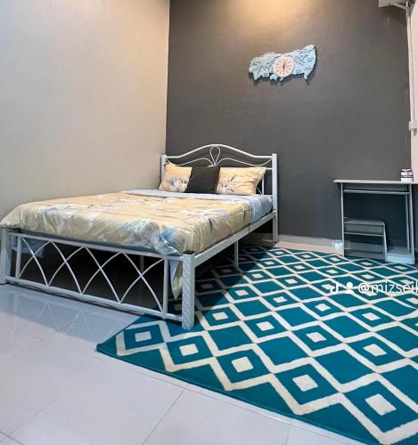 Ένα ή περισσότερα κρεβάτια σε δωμάτιο στο Sz Homestay