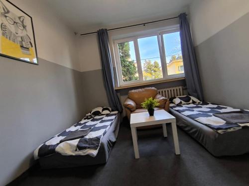 Posteľ alebo postele v izbe v ubytovaní Wilanowska Hostel