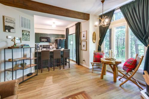 a living room with a kitchen and a dining room at Wintergreen Resort Condo with Deck, 0 3 Mi to Slopes in Lyndhurst