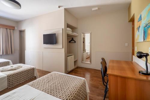 Postel nebo postele na pokoji v ubytování Hotel Cisne