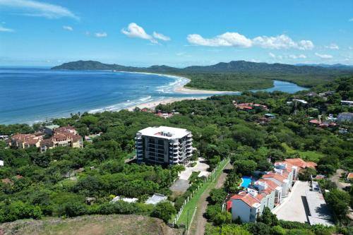 an aerial view of a resort and the beach at Monte Perla Condo at Tamarindo in Tamarindo