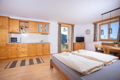 a large kitchen with two beds in a room at Alpenrelax Krepperhütte in Volders