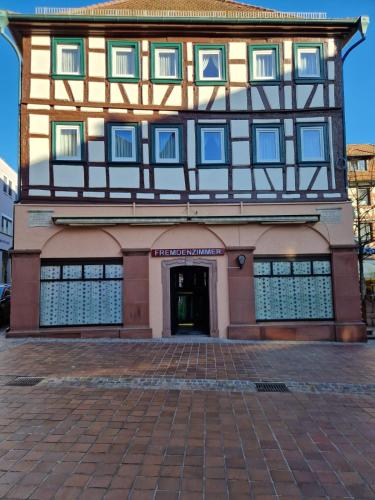 a building with a half timbered at QC5 Pension Buchen in Odenwald in Buchen