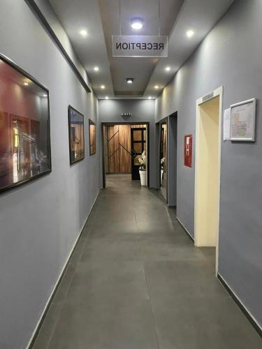 a hallway of a building with a sign on the ceiling at Hotel Kicevo in Kičevo