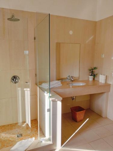 a bathroom with a sink and a shower at Belver Porto Dona Maria Resort in Luz